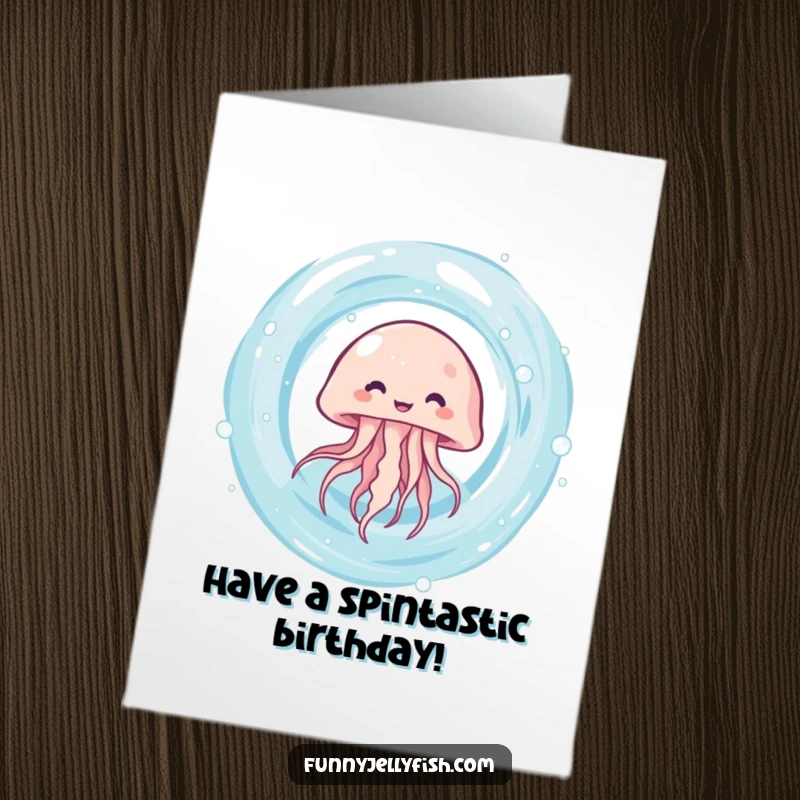 Funny free printable birthday card where a cute kawaii jellyfish giggles uncontrollably while spinning rapidly within a swirling water vortex.